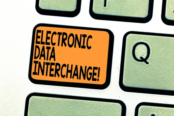 Text sign showing Electronic Data Interchange. Conceptual photo Transfer of data from one computer into another Keyboard key Intention to create computer message pressing keypad idea.