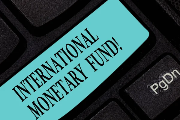 Text sign showing International Monetary Fund. Conceptual photo promotes international financial stability Keyboard key Intention to create computer message pressing keypad idea.
