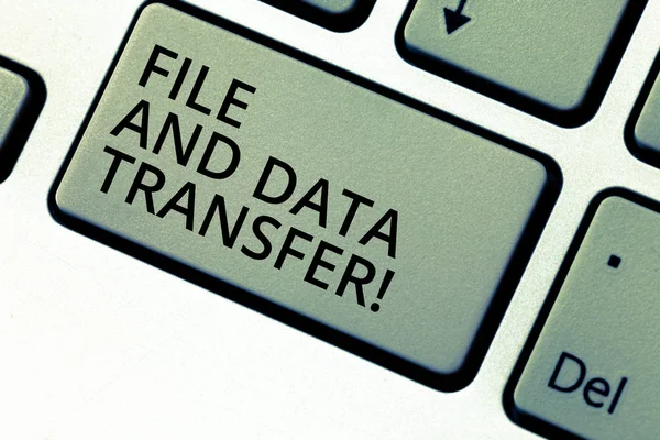 Writing note showing File And Data Transfer. Business photo showcasing Transferring information online by the internet Keyboard key Intention to create computer message pressing keypad idea.