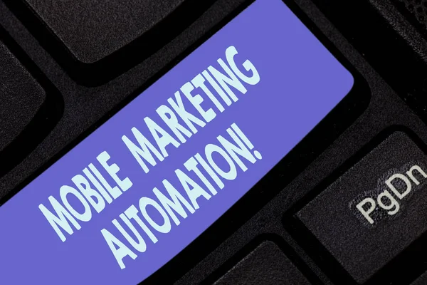 Handwriting text writing Mobile Marketing Automation. Concept meaning automate mobile marketing tasks and processes Keyboard key Intention to create computer message pressing keypad idea.