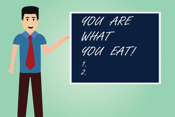 手書きテキスト書くあなたは食べるものです。概念のネクタイ立って話を提示空白色正方形ボード写真とあなたの食品男の世話をする健康的なライフ スタイルを持つ意味. — ストック写真