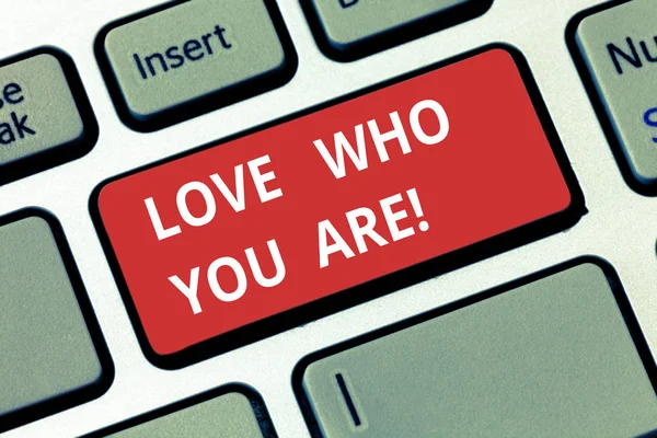 Text sign showing Love Who You Are. Conceptual photo Expressing roanalysistic feelings and positive emotions Keyboard key Intention to create computer message pressing keypad idea.