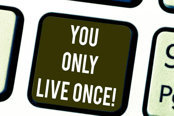Writing note showing You Only Live Once. Business photo showcasing Seize the day and be happy motivated enjoy life Keyboard key Intention to create computer message pressing keypad idea.