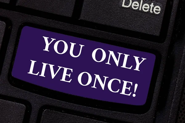 Writing note showing You Only Live Once. Business photo showcasing Seize the day and be happy motivated enjoy life Keyboard key Intention to create computer message pressing keypad idea.