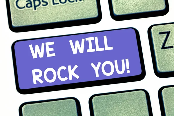 Handwriting text writing We Will Rock You. Concept meaning Rockers slogan Musical melody inspiration motivation Keyboard key Intention to create computer message pressing keypad idea.