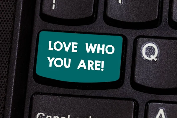 Text sign showing Love Who You Are. Conceptual photo Expressing roanalysistic feelings and positive emotions Keyboard key Intention to create computer message pressing keypad idea.