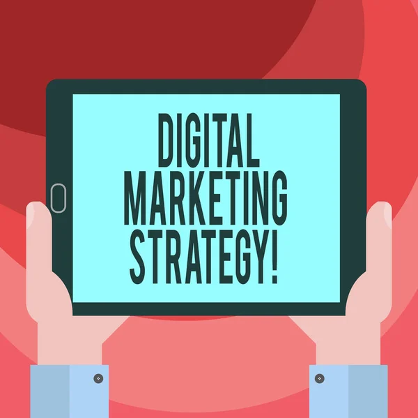 Text sign showing Digital Marketing Strategy. Conceptual photo actions that help achieve your company goals Hu analysis Hand Holding Blank Screen Tablet Smartphone Display Unit photo.