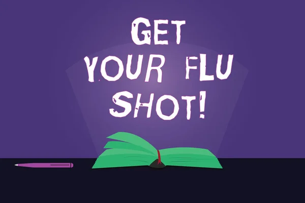 Note d'écriture montrant Get Your Flu Shot. Présentation de photos d'affaires Avoir une vaccination pour éviter d'être malade immunisation Pages couleur du livre sur la table avec stylo et faisceau lumineux Glaring . — Photo