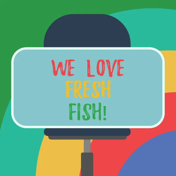 개념적 손을 우리 사랑 신선한 생선을 보여주는 작성입니다. 비즈니스 사진 텍스트 해산물 애호가 건강 식품 해양 요리 요리 예술 빈 직사각형 모양 스티커에 앉아 회전의 자. — 스톡 사진