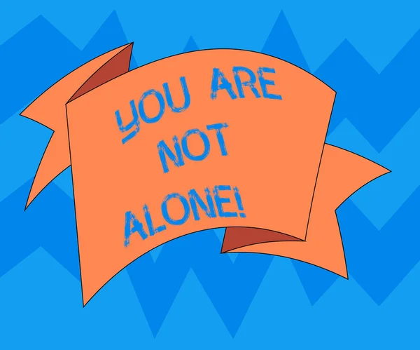 Text sign showing You Are Not Alone. Conceptual photo Offering help support assistance collaboration company Folded 3D Ribbon Strip Solid Color Blank Sash photo for Celebration.