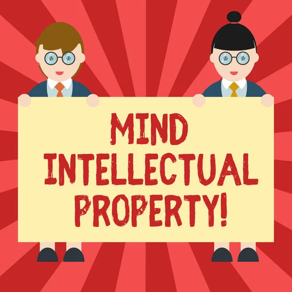 Conceptual hand writing showing Mind Intellectual Property. Business photo showcasing Refers to creations of the mind such as invention Male and Female in Uniform Holding Placard Banner Text Space.