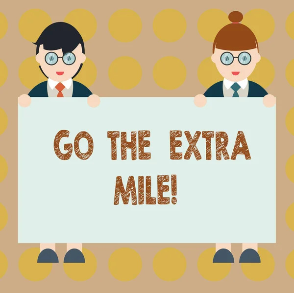 Текст слова Go The Extra Mile. Business concept for Give an additional do more than is expected from you Male and Female in Uniform Standing Holding Blank Placard Text Space . — стоковое фото