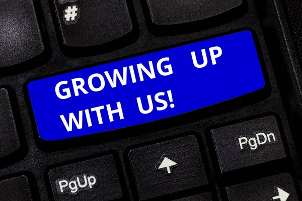 Text sign showing Growing Up With Us. Conceptual photo Offering help assistance to make your business grow Keyboard key Intention to create computer message pressing keypad idea.