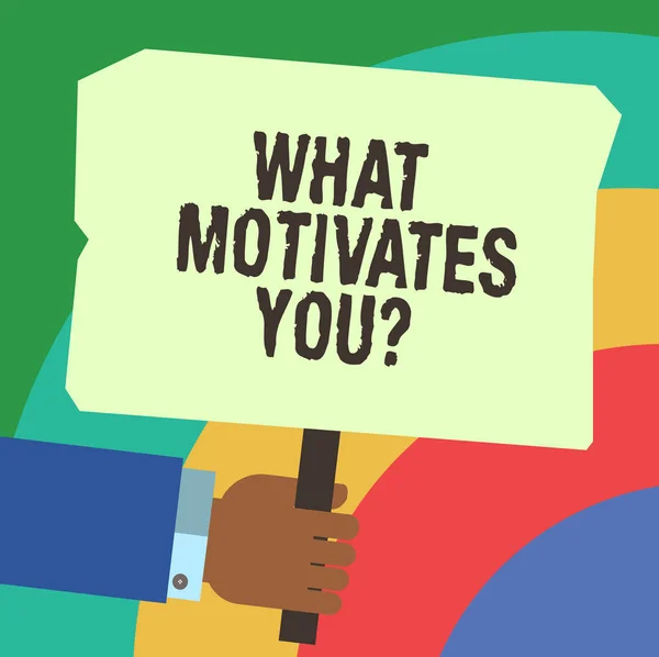 Handwriting text writing What Motivates Youquestion. Concept meaning Asking for reason that makes you do what you do Hu analysis Hand Holding Blank Colored Placard with Stick photo Text Space.