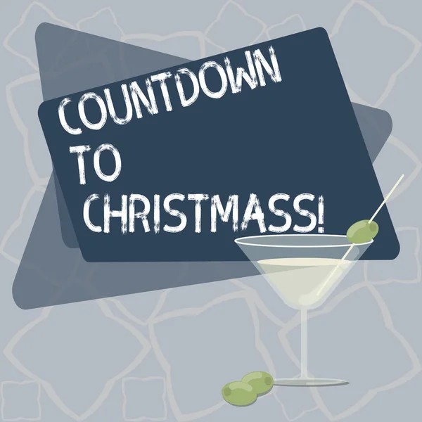 Writing note showing Countdown To Christmas. Business photo showcasing period of time leading up to a significant event Filled Cocktail Wine Glass with Olive on the Rim Text Space.