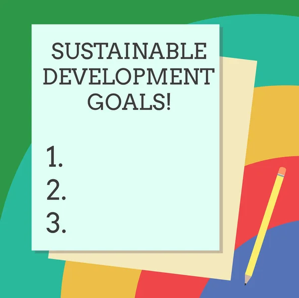 Word writing text Sustainable Development Goals. Business concept for Unite Nations Global vision for huanalysisity Stack of Blank Different Pastel Color Construction Bond Paper and Pencil. — Stockfoto