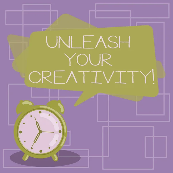Text sign showing Unleash Your Creativity. Conceptual photo Getting in touch what you are passionate about Blank Rectangular Color Speech Bubble Overlay and Analog Alarm Clock. — Stock Photo, Image