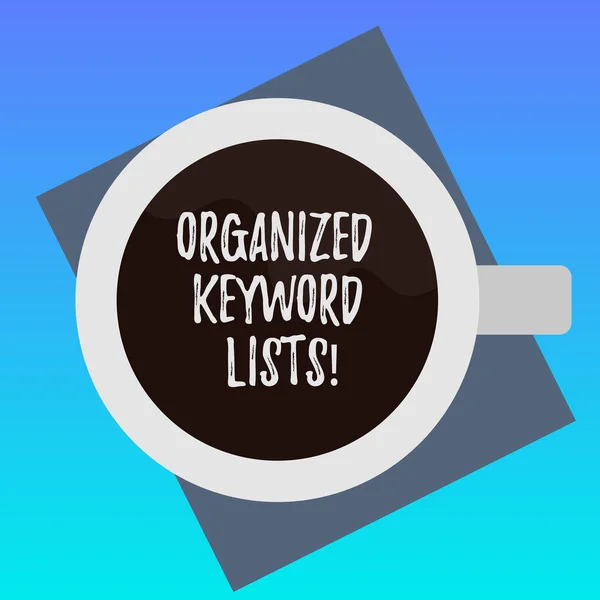 Handwriting text writing Organized Keyword Lists. Concept meaning Taking list of keywords and place them in groups Top View of Drinking Cup Filled with Beverage on Color Paper photo.