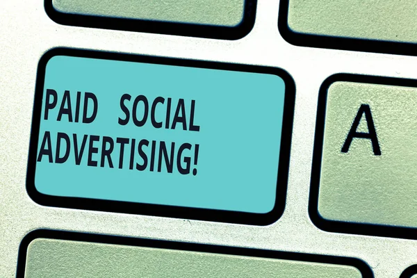Writing note showing Paid Social Advertising. Business photo showcasing external marketing efforts involve a paid placement Keyboard key Intention to create computer message pressing keypad idea.