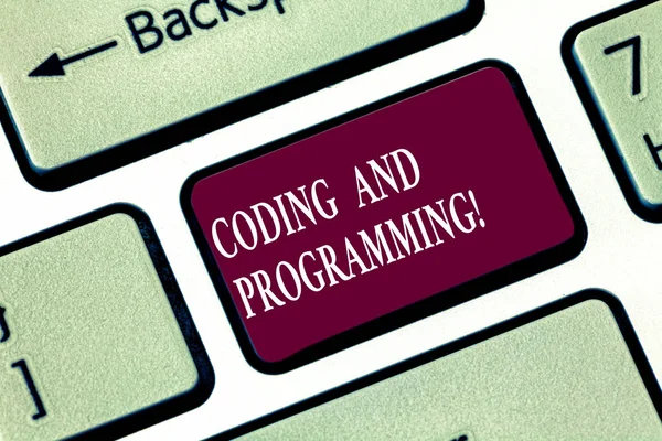 Writing note showing Coding And Programming. Business photo showcasing Design and build an executable computer program Keyboard key Intention to create computer message pressing keypad idea. — Stock Photo, Image
