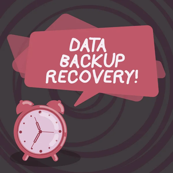 Word writing text Data Backup Recovery. Business concept for the process of backing up data in case of a loss Blank Rectangular Color Speech Bubble Overlay and Analog Alarm Clock.