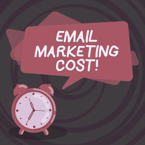 Word writing text Email Marketing Cost. Business concept for Is the price for sending a thousand email messages Blank Rectangular Color Speech Bubble Overlay and Analog Alarm Clock.