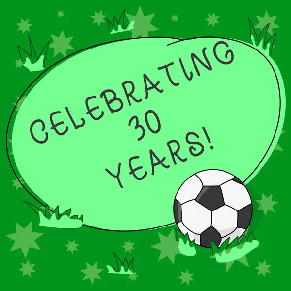 Writing note showing Celebrating 30 Years. Business photo showcasing Commemorating a special day being 30 years together Soccer Ball on the Grass and Blank Outlined Round Color Shape photo