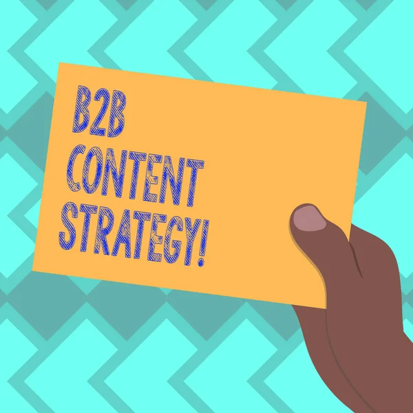 Text sign showing B2B Content Strategy. Conceptual photo Distributing curated, relevant and valuable content Drawn Hu analysis Hand Holding Presenting Blank Color Paper Cardboard photo.