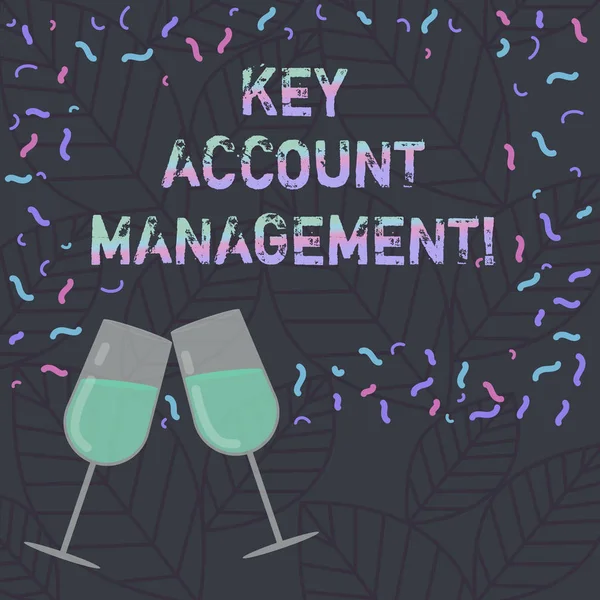 Conceptual hand writing showing Key Account Management. Business photo text Selling products to big customers and clients Filled Wine Glass for Celebration with Scattered Confetti photo.