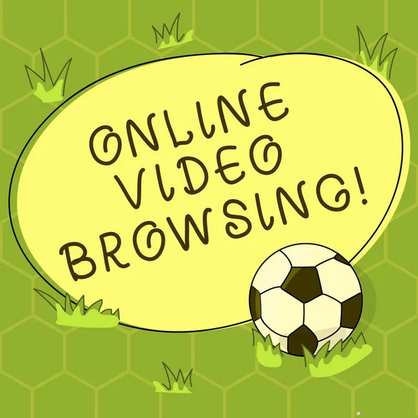 Conceptual hand writing showing Online Video Browsing. Business photo showcasing interactive process of skimming through video content Soccer Ball on the Grass and Blank Round Color Shape photo.