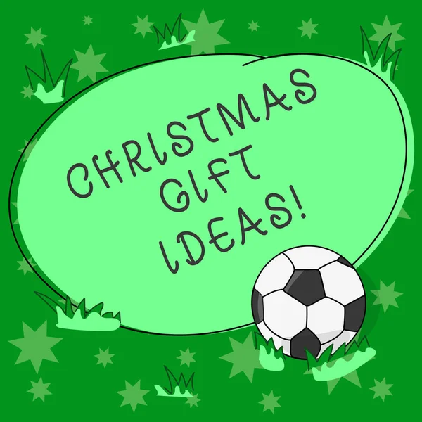 Writing note showing Christmas Gift Ideas. Business photo showcasing Suggestion for best presents to give in Christmas day Soccer Ball on the Grass and Blank Outlined Round Color Shape photo.