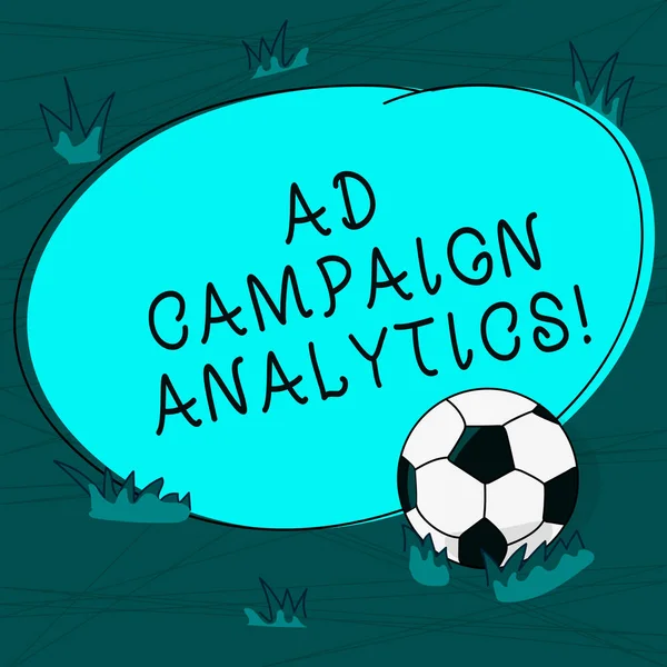 Conceptual hand writing showing Ad Campaign Analytics. Business photo text monitor campaigns and their respective outcomes Soccer Ball on the Grass and Blank Round Color Shape photo.