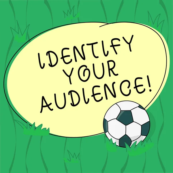 Word writing text Identify Your Audience. Business concept for Figuring out the target audience and their needs Soccer Ball on the Grass and Blank Outlined Round Color Shape photo.