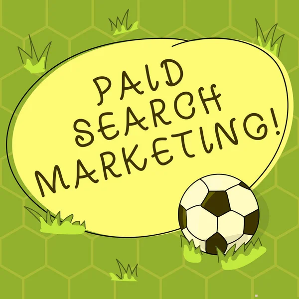 Conceptual hand writing showing Paid Search Marketing. Business photo showcasing way to pay to ads through the internet search engines Soccer Ball on the Grass and Blank Round Color Shape photo.