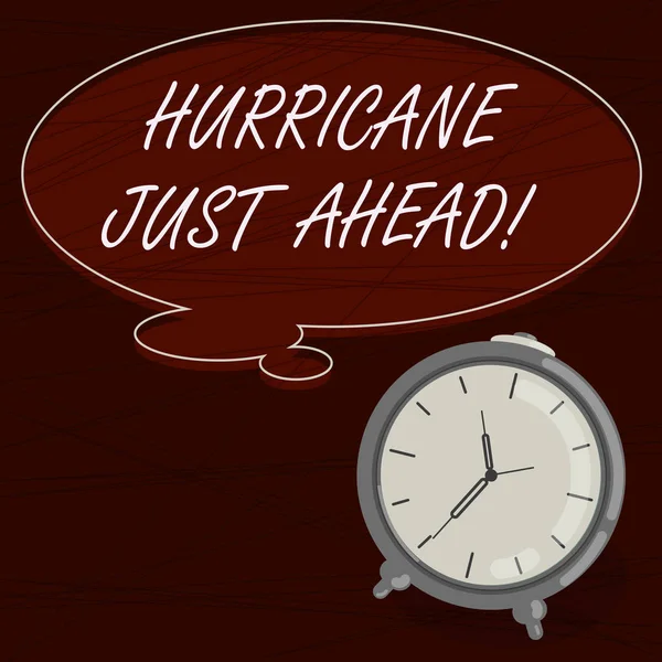 Text sign showing Hurricane Just Ahead. Conceptual photo violent tropical cyclone is approaching to hit the land Blank Color Thought Speech Bubble with Outline and Alarm Clock photo.