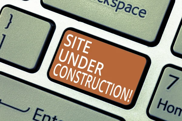 Handwriting text Site Under Construction. Concept meaning Implies something is being built for the first time Keyboard key Intention to create computer message pressing keypad idea. — Stock Photo, Image