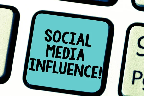 Text sign showing Social Media Influence. Conceptual photo Individuals ability to affect others thinking Keyboard key Intention to create computer message pressing keypad idea.