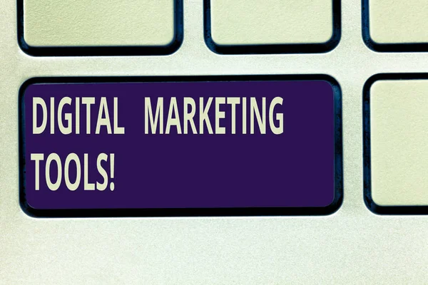 Text sign showing Digital Marketing Tools. Conceptual photo Channels or platforms use in advertising a product Keyboard key Intention to create computer message pressing keypad idea.