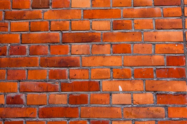Tło grunge tekstury ściany z czerwonej cegły z winietowane narożniki, może użyć do wystroju wnętrz. Stara Cegła pomarańczowa — Zdjęcie stockowe