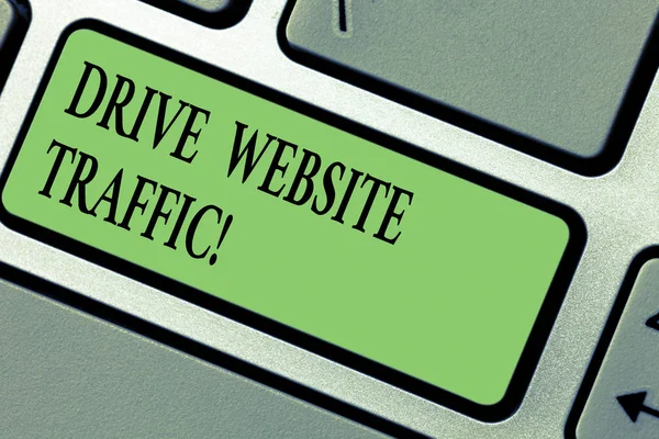 Handwriting text writing Drive Website Traffic. Concept meaning Increase the number of visitors to business website Keyboard key Intention to create computer message pressing keypad idea.