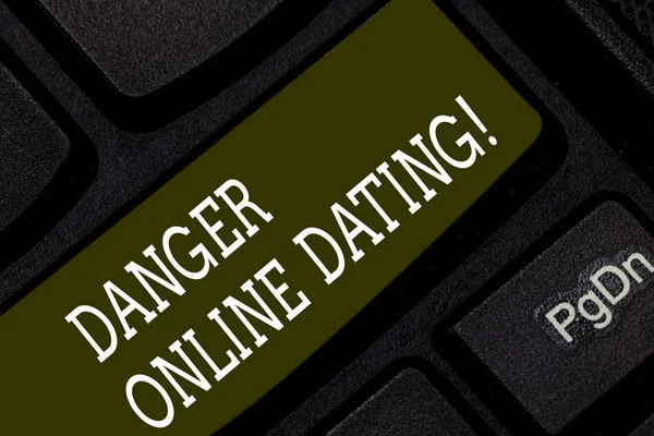 Writing note showing Danger Online Dating. Business photo showcasing The risk of meeting or dating demonstrating meet online Keyboard key Intention to create computer message pressing keypad idea.