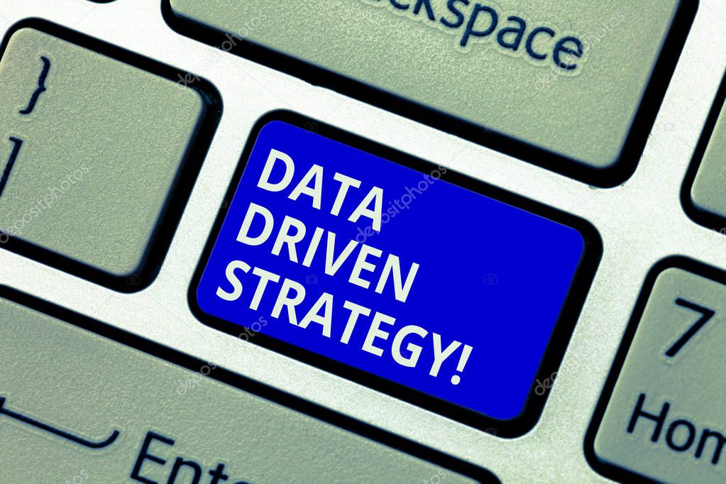 Text sign showing Data Driven Strategy. Conceptual photo decisions based on data analysis and interpretation Keyboard key Intention to create computer message pressing keypad idea.