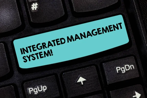 Text sign showing Integrated Management System. Conceptual photo combines all components of a business into one Keyboard key Intention to create computer message pressing keypad idea.