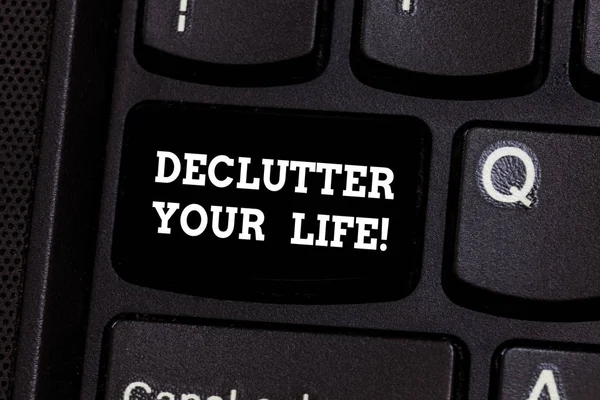 Text sign showing Declutter Your Life. Conceptual photo remove unnecessary items from untidy overcrowded place Keyboard key Intention to create computer message pressing keypad idea. — Stock Photo, Image