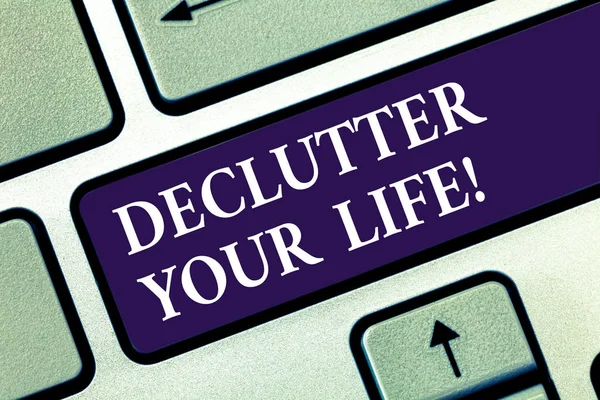 Text sign showing Declutter Your Life. Conceptual photo remove unnecessary items from untidy overcrowded place Keyboard key Intention to create computer message pressing keypad idea. — Stock Photo, Image