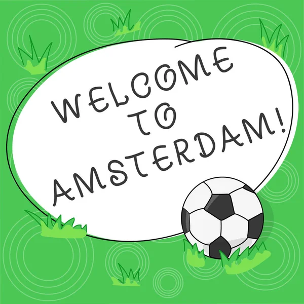 Writing note showing Welcome To Amsterdam. Business photo showcasing Greeting someone visits the capital city of Netherlands Soccer Ball on the Grass and Blank Outlined Round Color Shape photo.