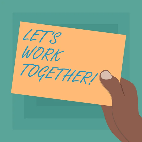 Conceptual hand writing showing Let S Is Work Together. Business photo showcasing Asking partners colleges to do work with you Drawn Hu analysis Hand Holding Blank Color Paper Cardboard.