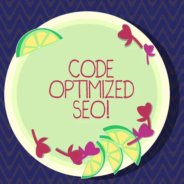 Text sign showing Code Optimized Seo. Conceptual photo process of affecting visibility website in search engine Cutouts of Sliced Lime Wedge and Herb Leaves on Blank Round Color Plate.
