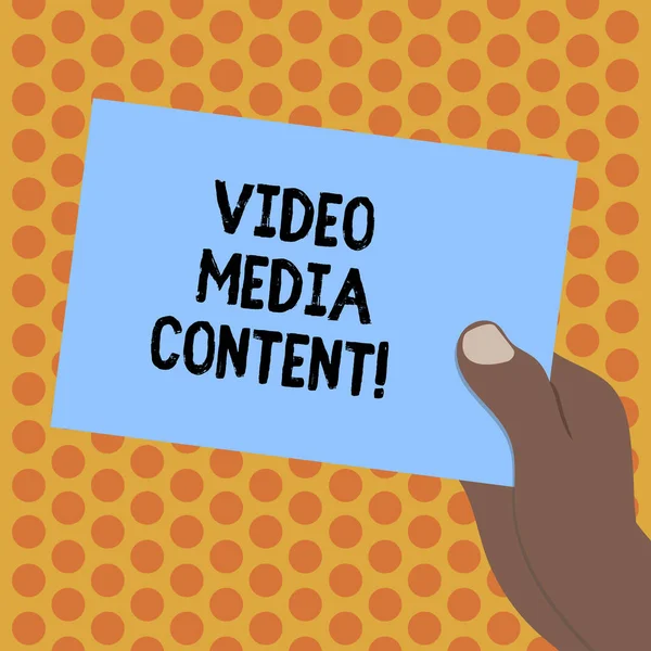Writing note showing Video Media Content. Business photo showcasing images and audio used to communicate brand message Drawn Hu analysis Hand Holding Blank Color Paper Cardboard.