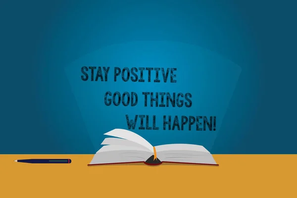 Handwriting text Stay Positive Good Things Will Happen. Concept meaning Keep your motivation inspiration Color Pages of Open Book photo on Table with Pen and Light Beam Glaring. — Stock Photo, Image